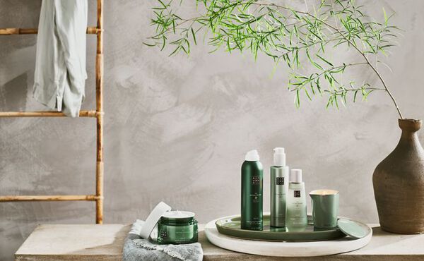 The Ritual of Jing collection displayed in a calming setting, with green packaging symbolising peace and serenity.