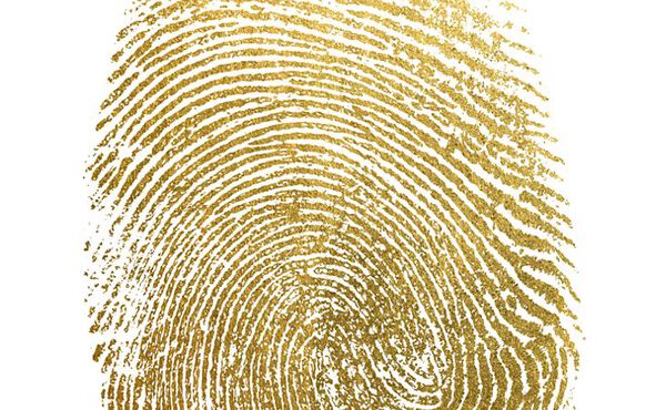 Gold fingerprint on a white background, symbolising individuality, authenticity and personal identity.