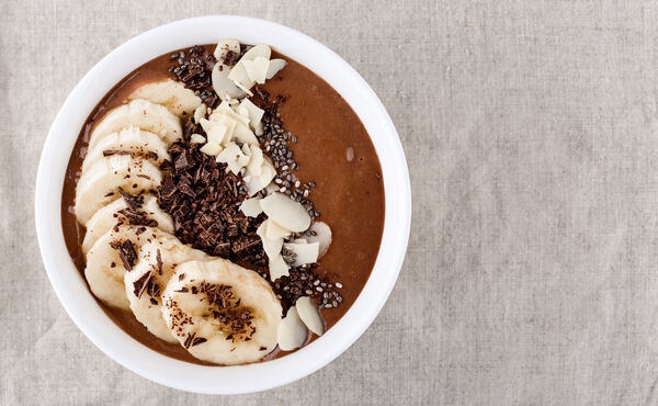 Banana chocolate smoothie bowl with peanut butter