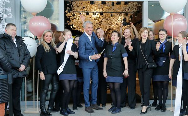Rituals CEO Raymond Cloosterman celebrating with store team at a special opening event.