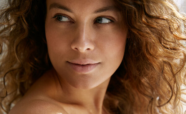 Close-up of woman with healthy, hydrated skin.